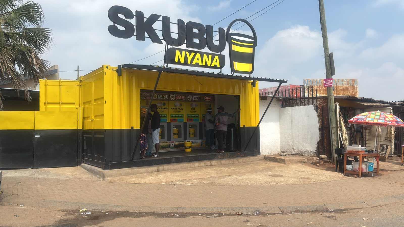 SKUBU Nyana refill retail store, daytime, showing dispensing units for staples like rice, maize meal and sugar